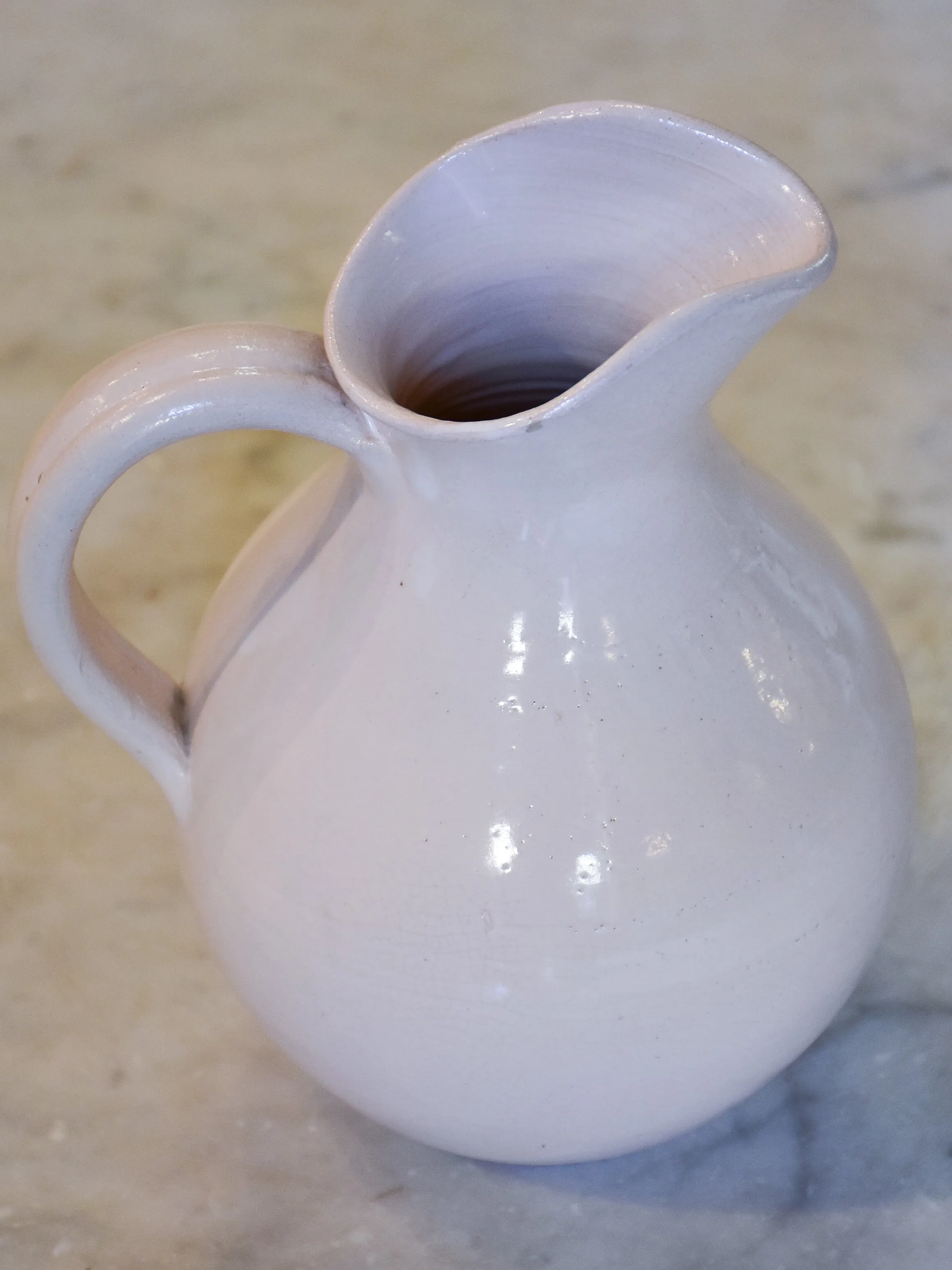 Antique French terracotta pitcher with white glaze