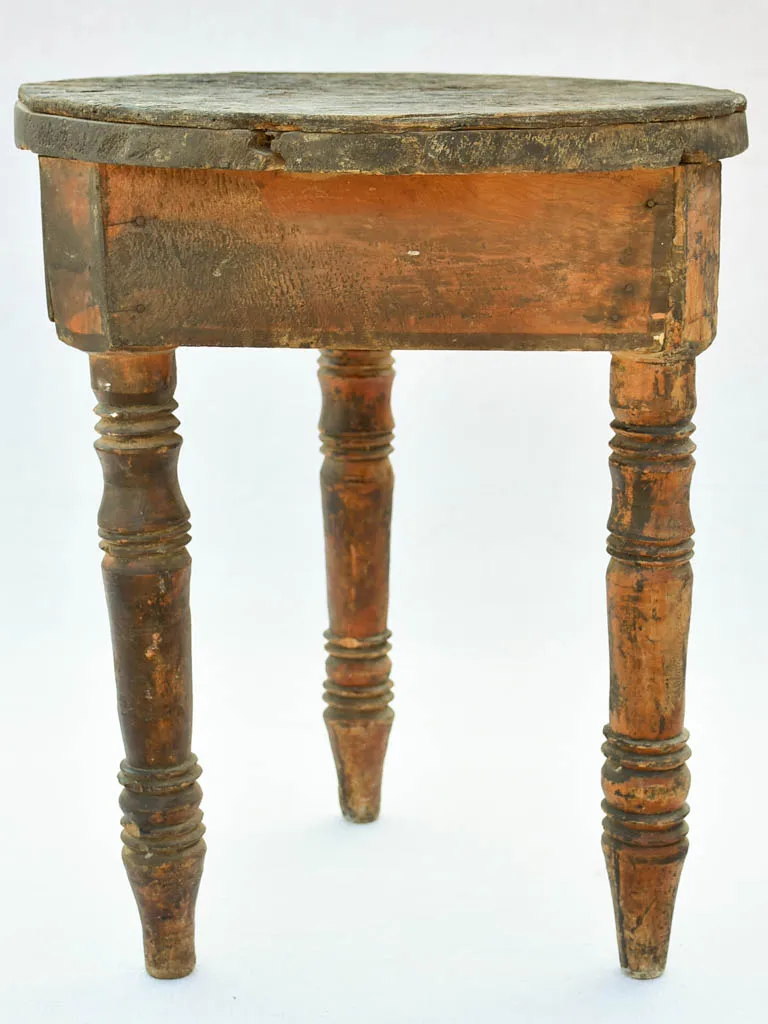 Small antique wooden side table with three legs